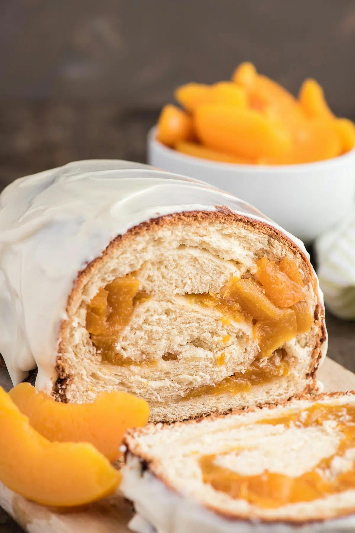 Peaches and cream swirl bread with a slice cut.