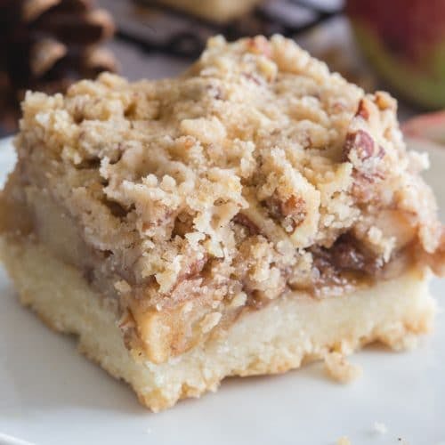 an apple pie bar on a white plate.