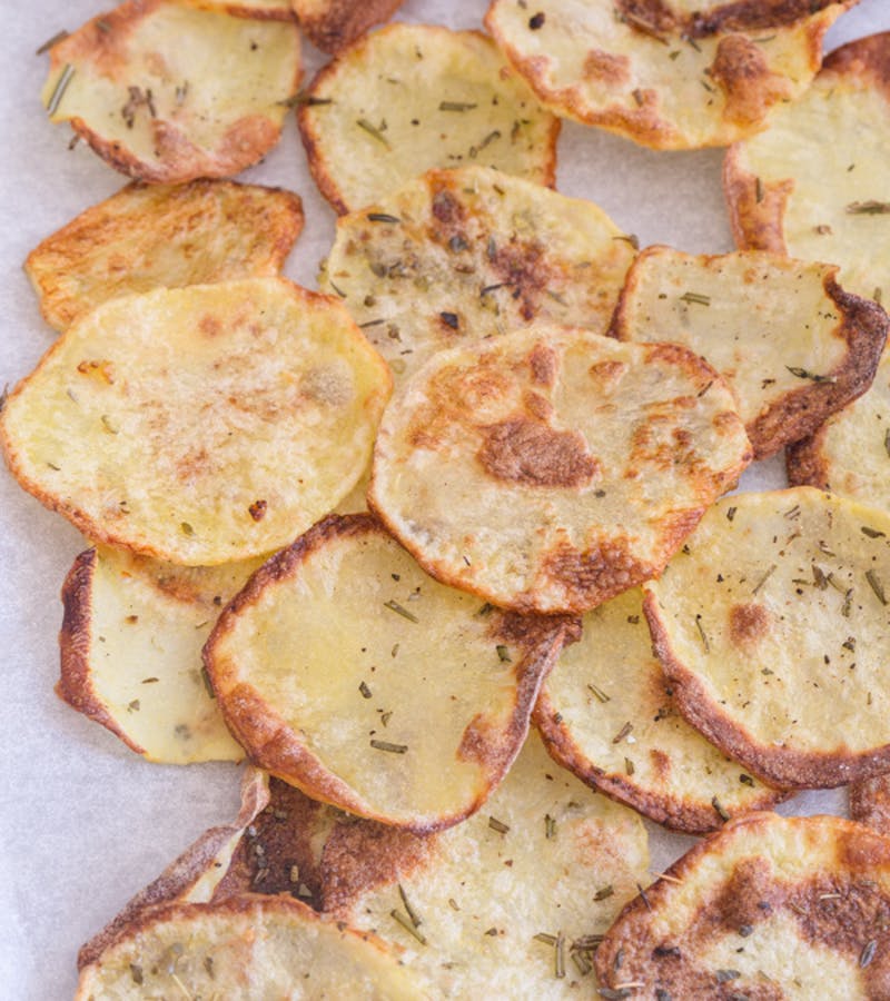 Baked potato chips on a cookie sheet.