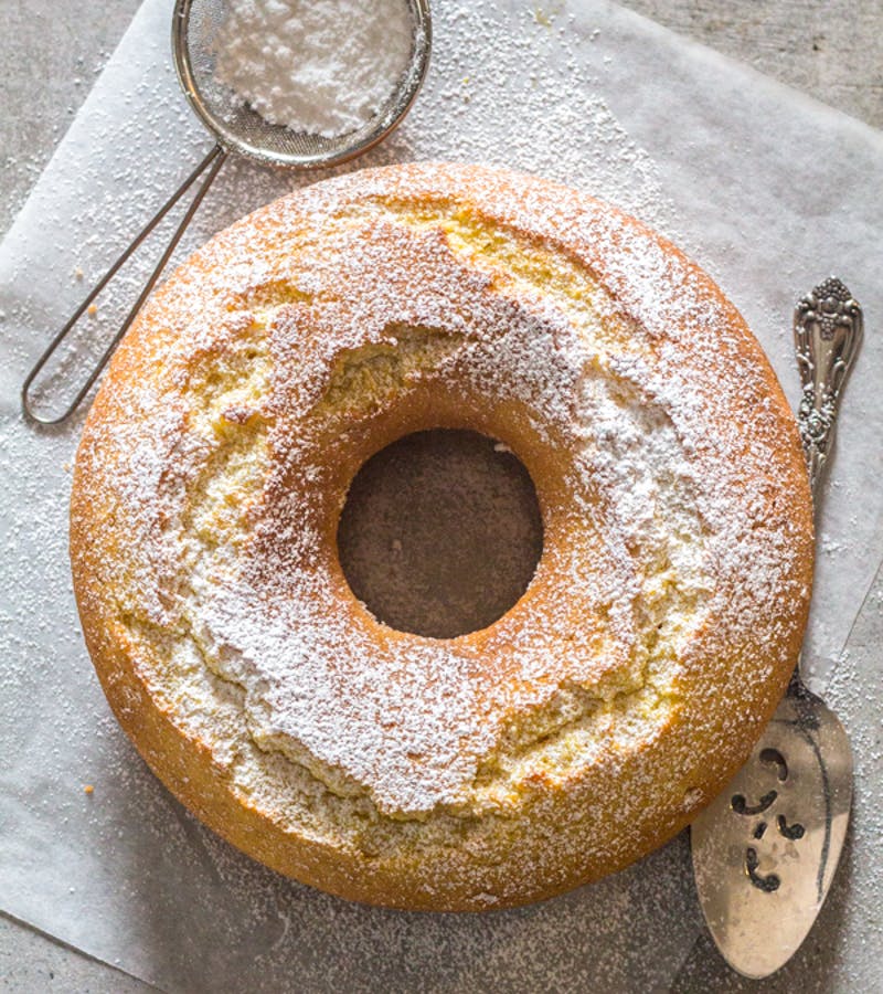 Fresh cream lemon cake on parchment paper.