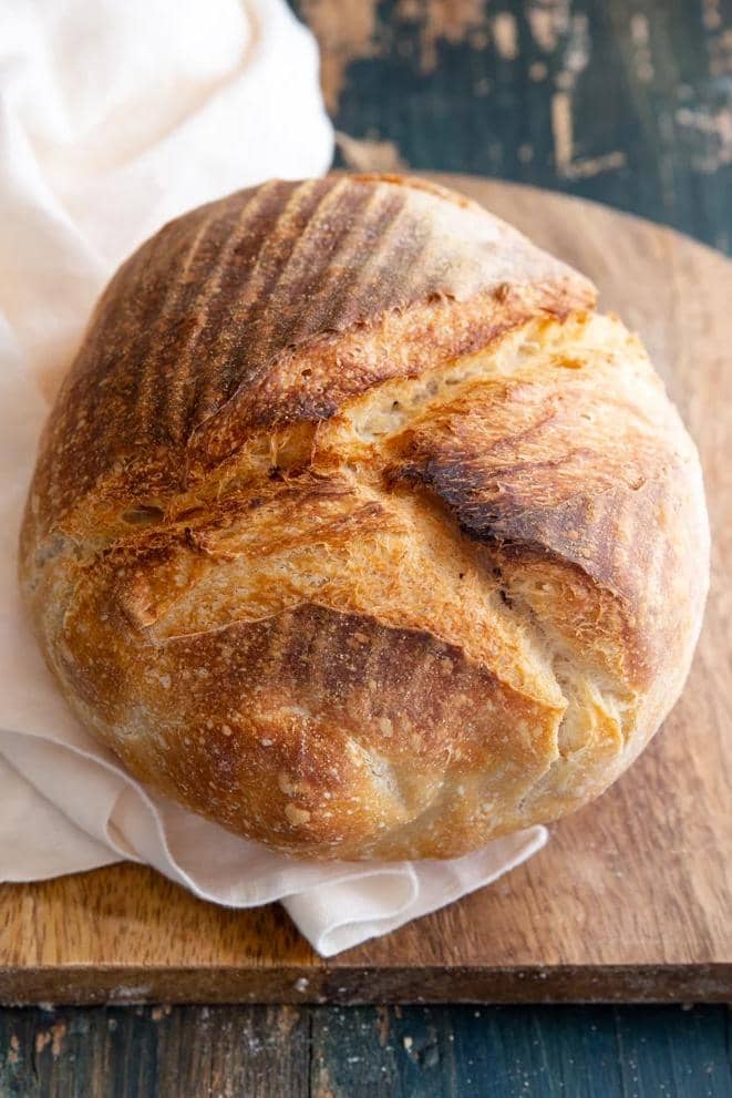 Sourdough French country bread on wooden board.