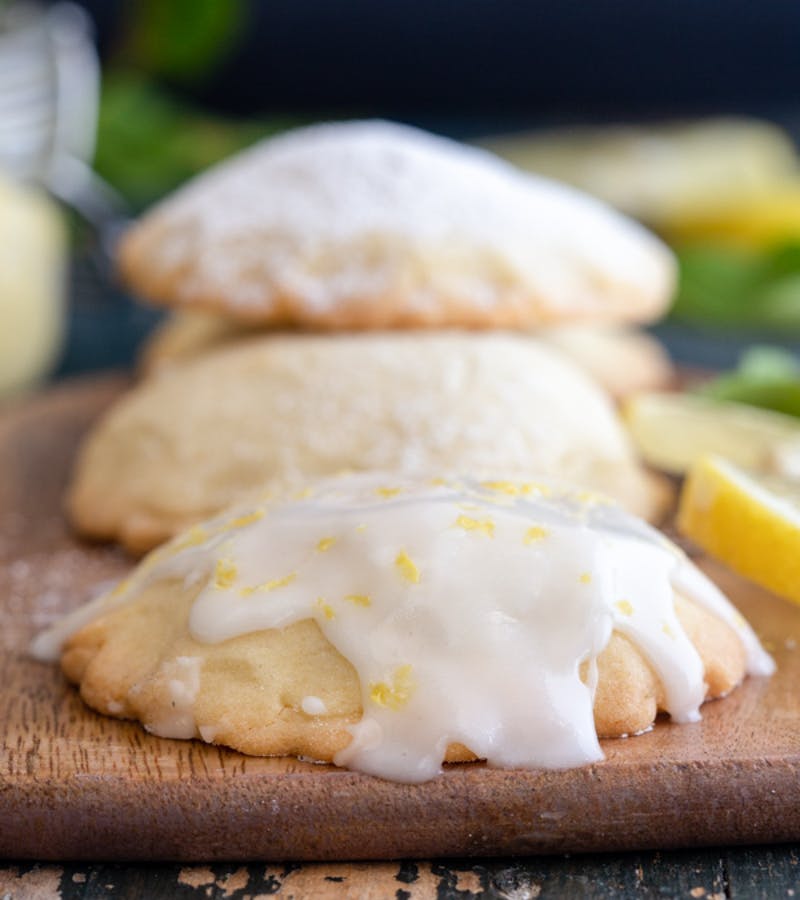 Stuffed lemon cookies on a wooden board.