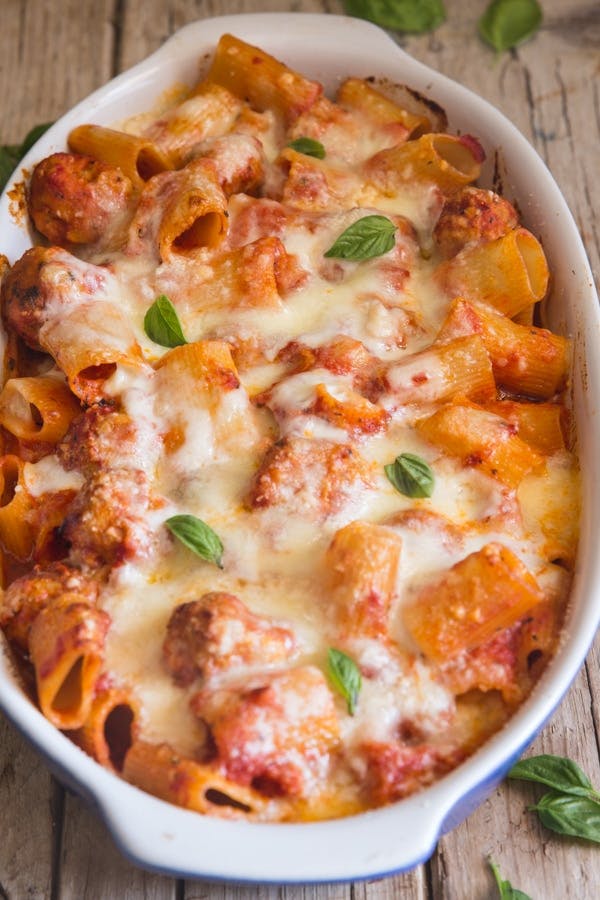 Baked meatball turkey casserole in a white dish.