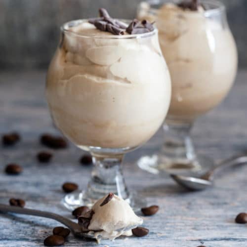 Coffee cream in 2 glasses with chocolate shavings on top