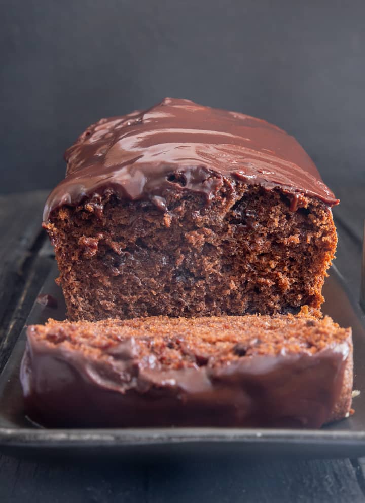 Double chocolate banana bread with a slice cut.