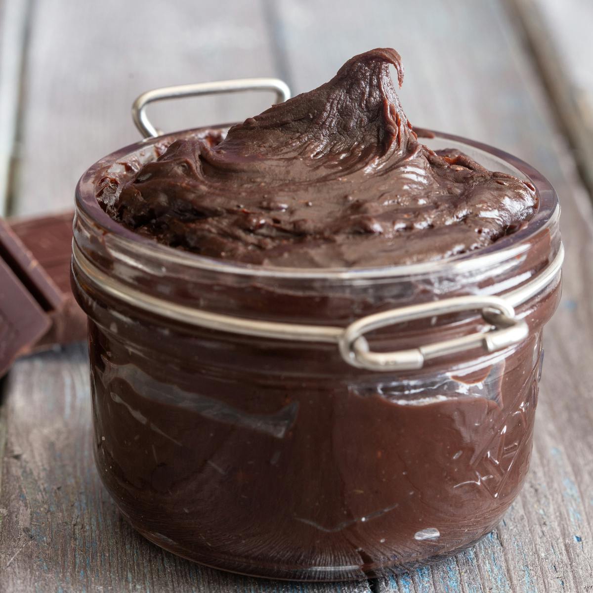 Chocolate cream spread in a glass jar.