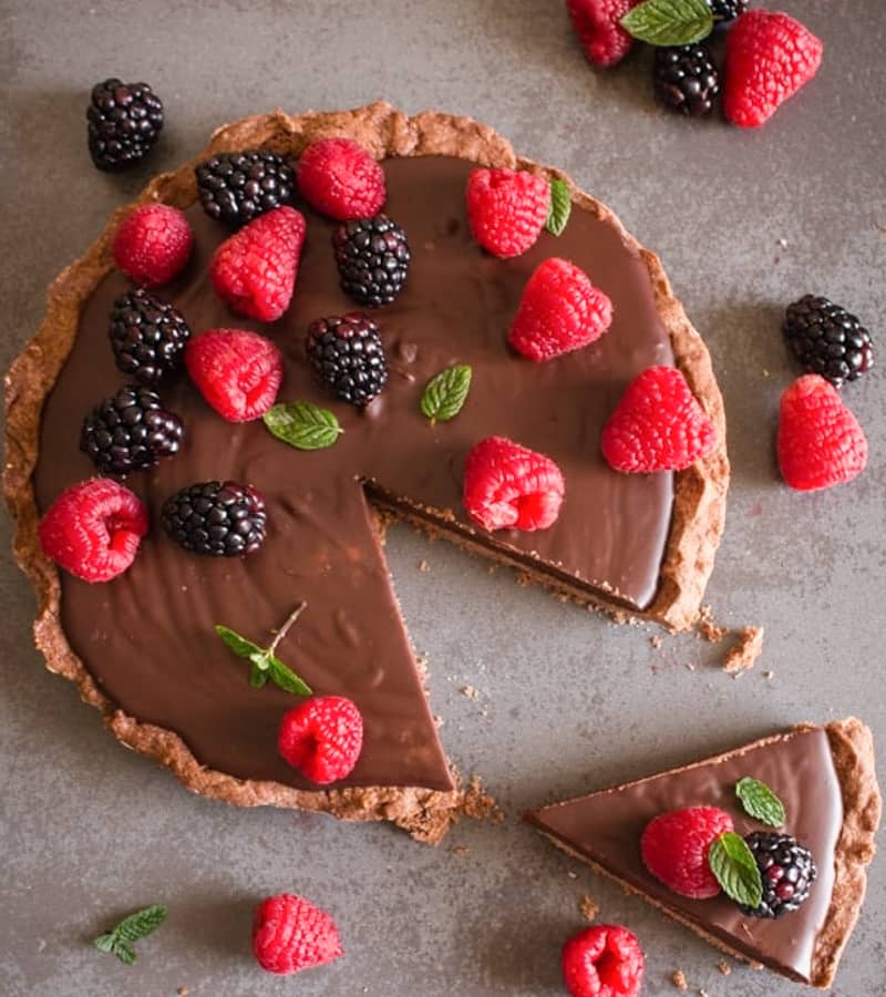 Creamy Italian double chocolate pie with a slice cut on a black board.