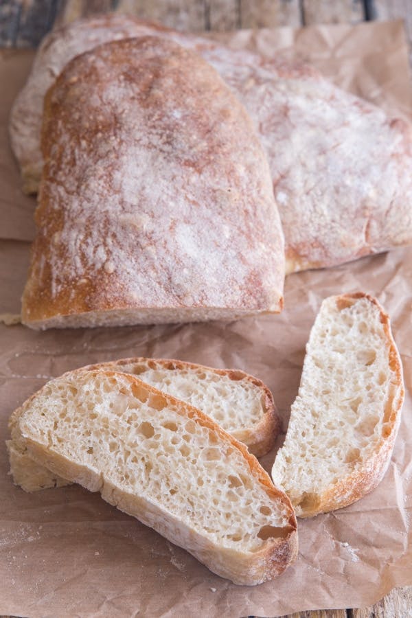 Italian ciabatta bread with 3 slices cut. 