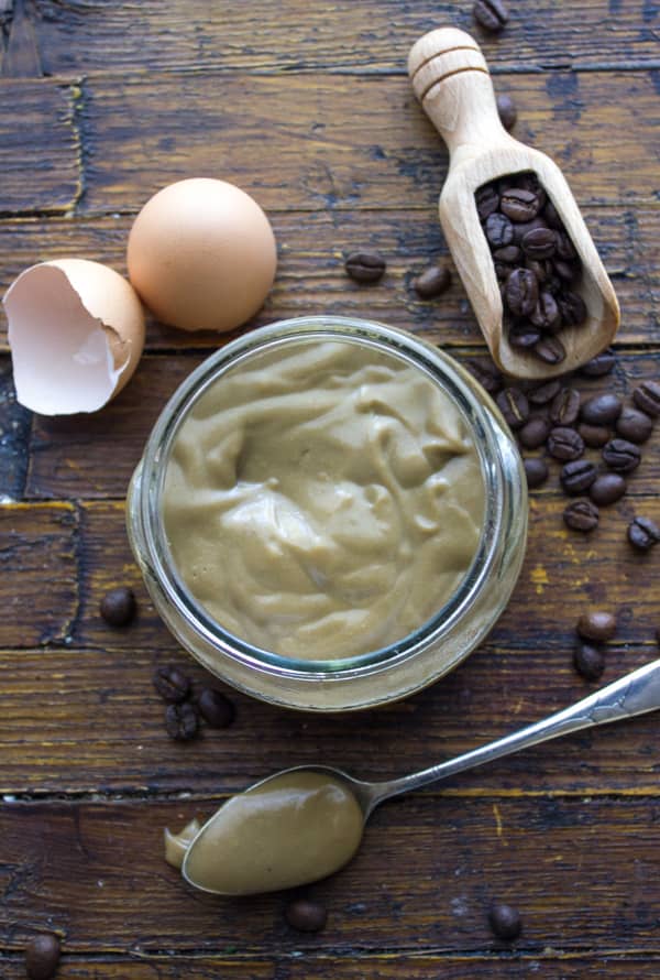 Coffee pastry cream in a bowl and spoon.