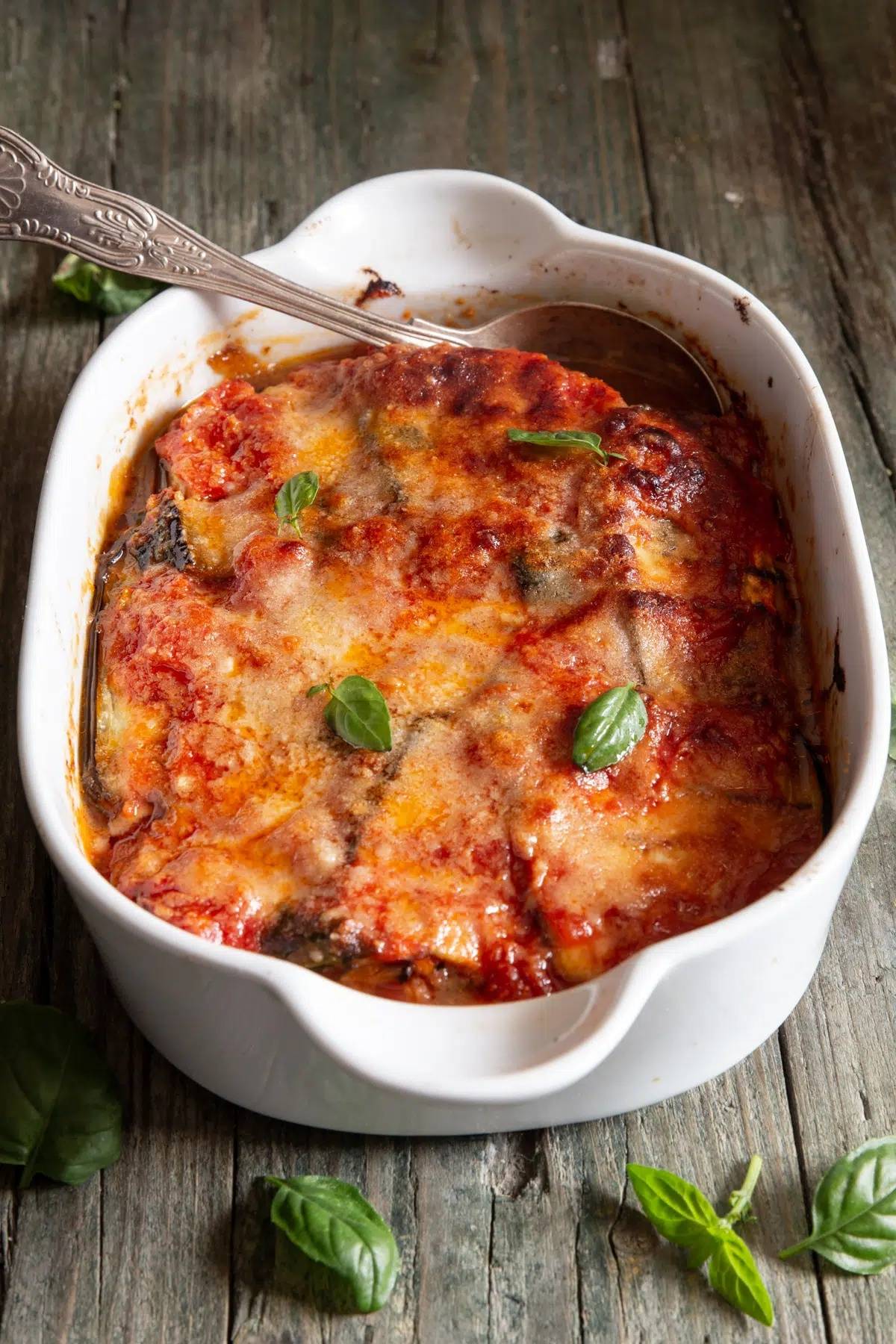 Eggplant mess in a white baking dish.