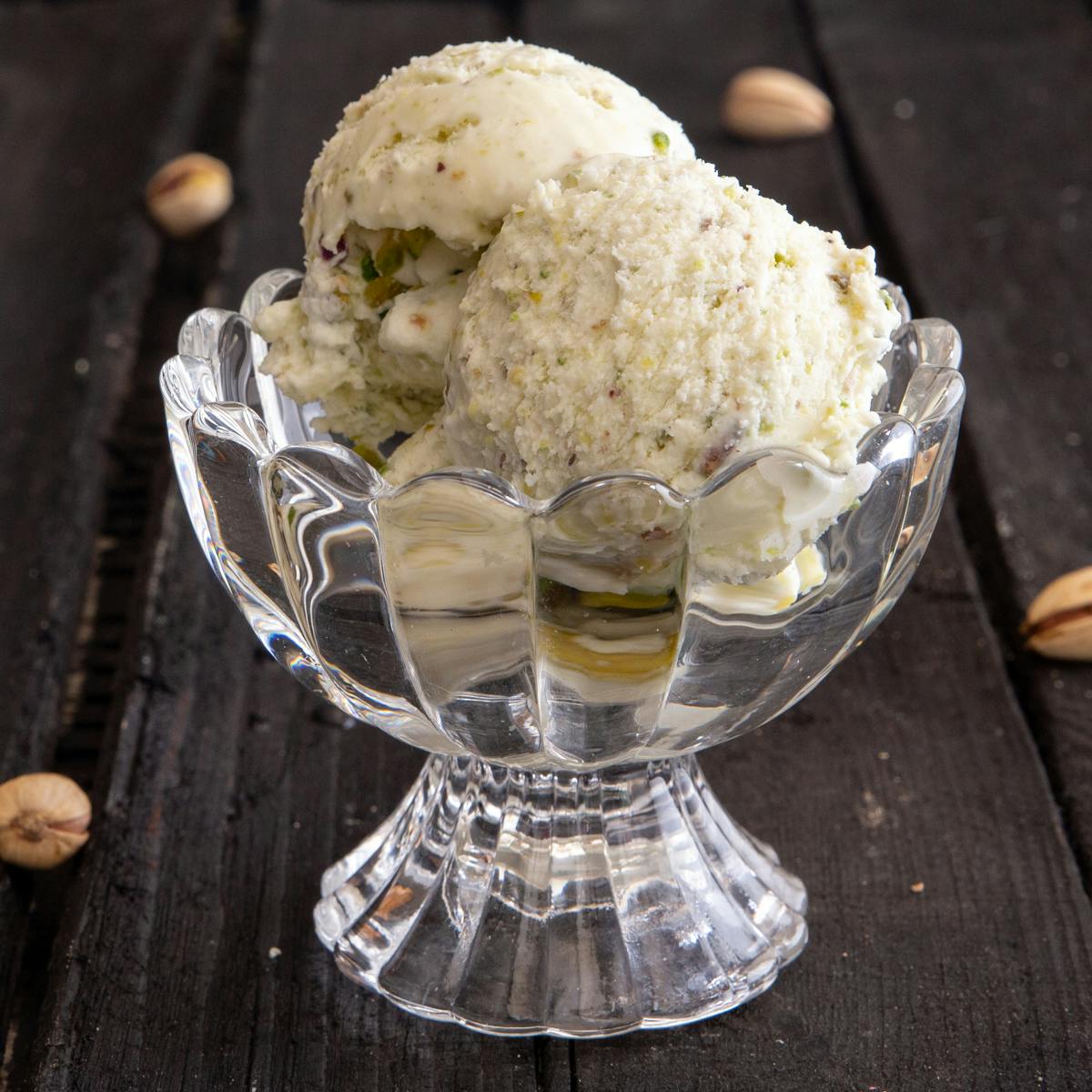 Pistachio ice cream in a glass bowl.