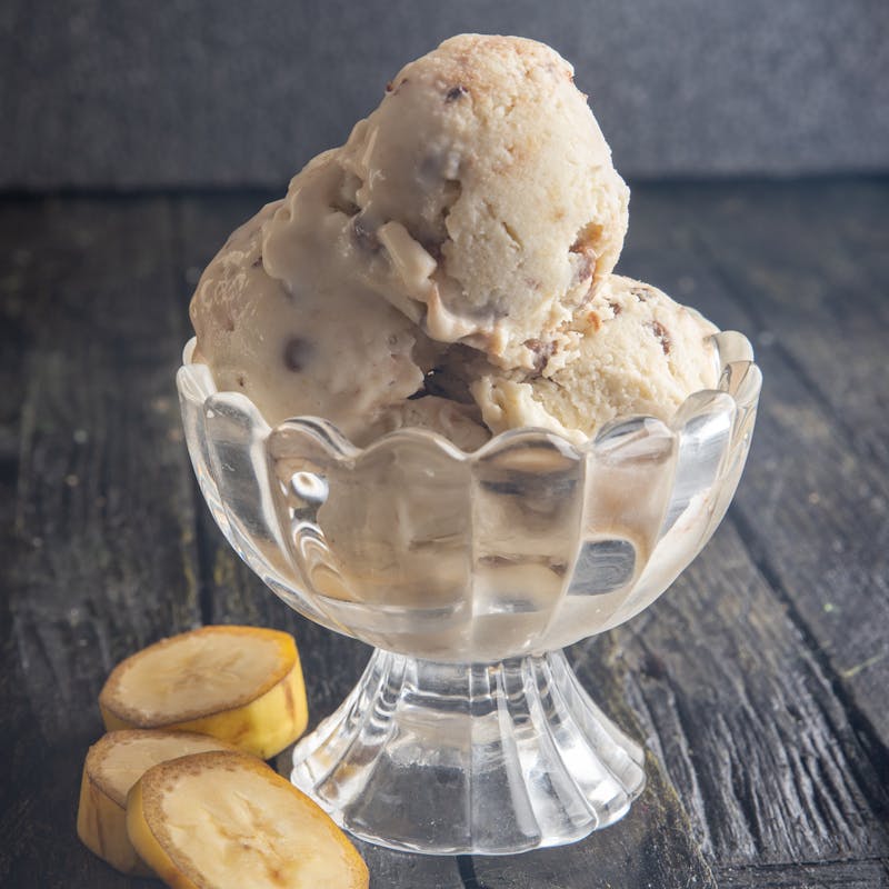 Ice cream scoops in a glass bowl.