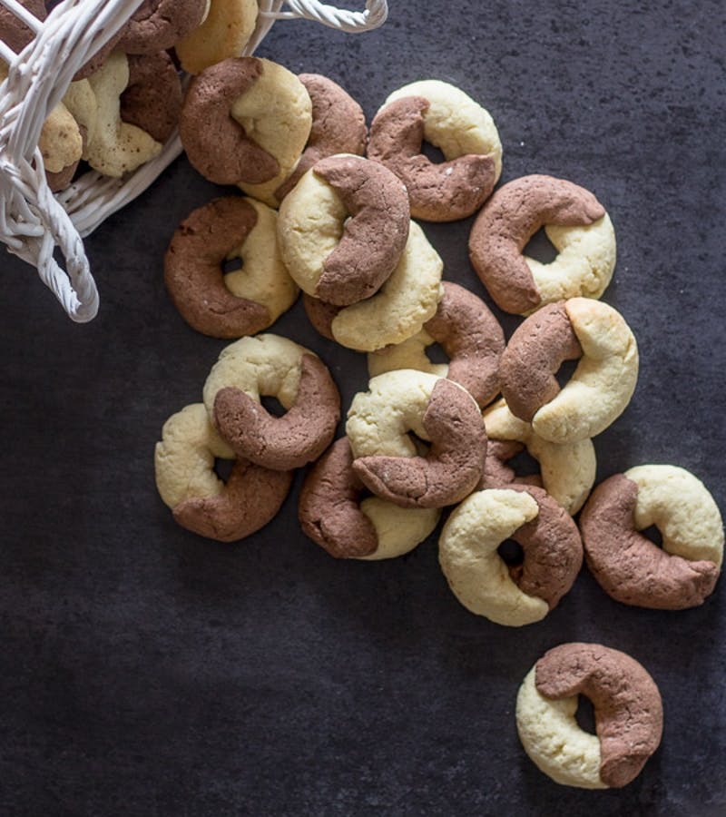 Abbracci Italian cookies on a black board.