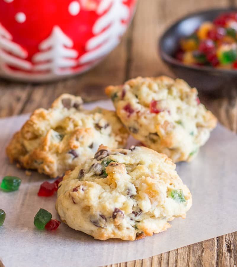 Nutty chocolate chip fruitcake cookies on parchment paper.