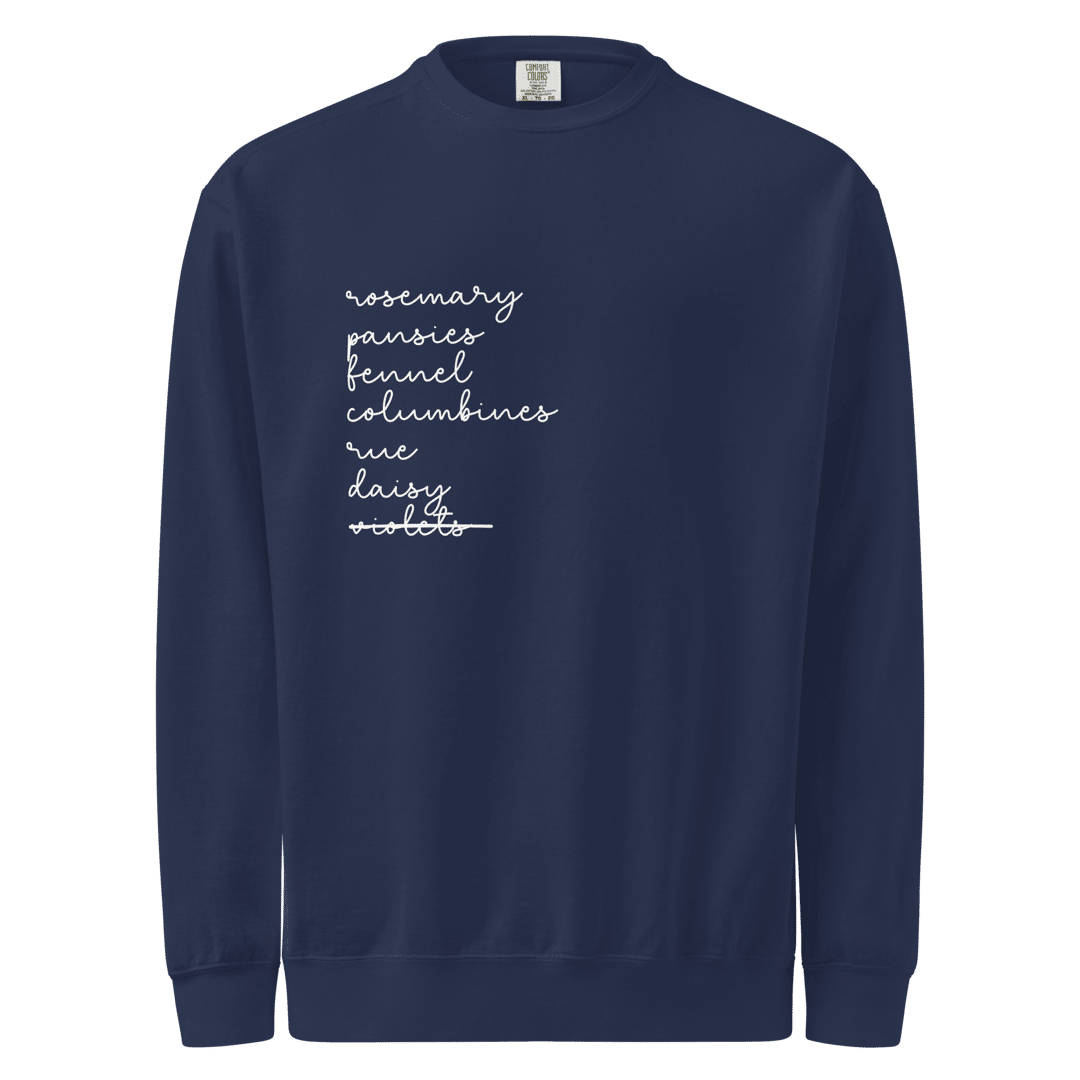 a navy crewneck sweatshirt featuring the words "rosemary, pansies, fennel, columbines, rue, daisy" printed in a column on the right side of the chest. The words are printed in white in a cursive handwriting font. 