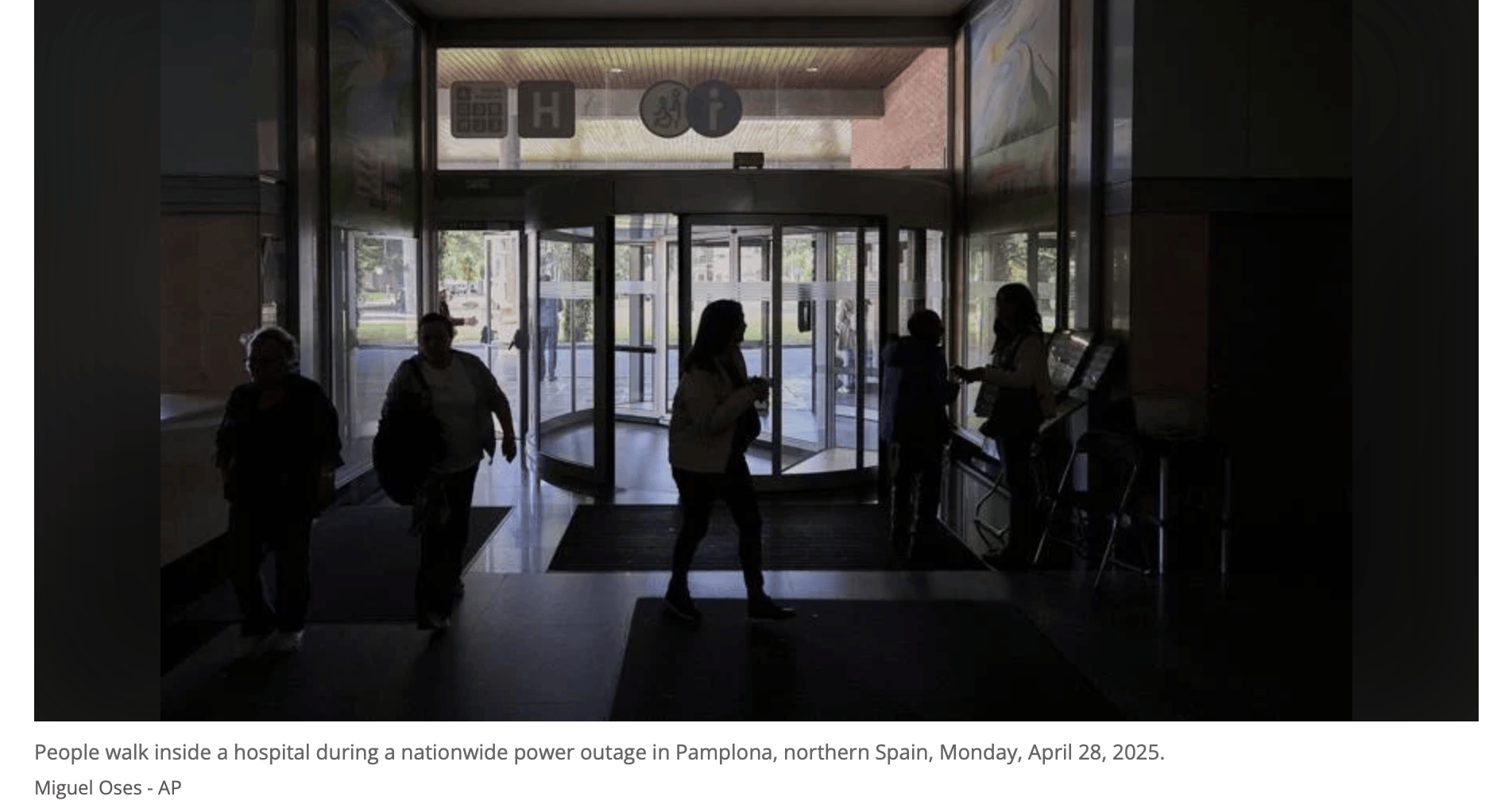 people walking in hospital in pamplona during power outage, pic by miguel oses AP