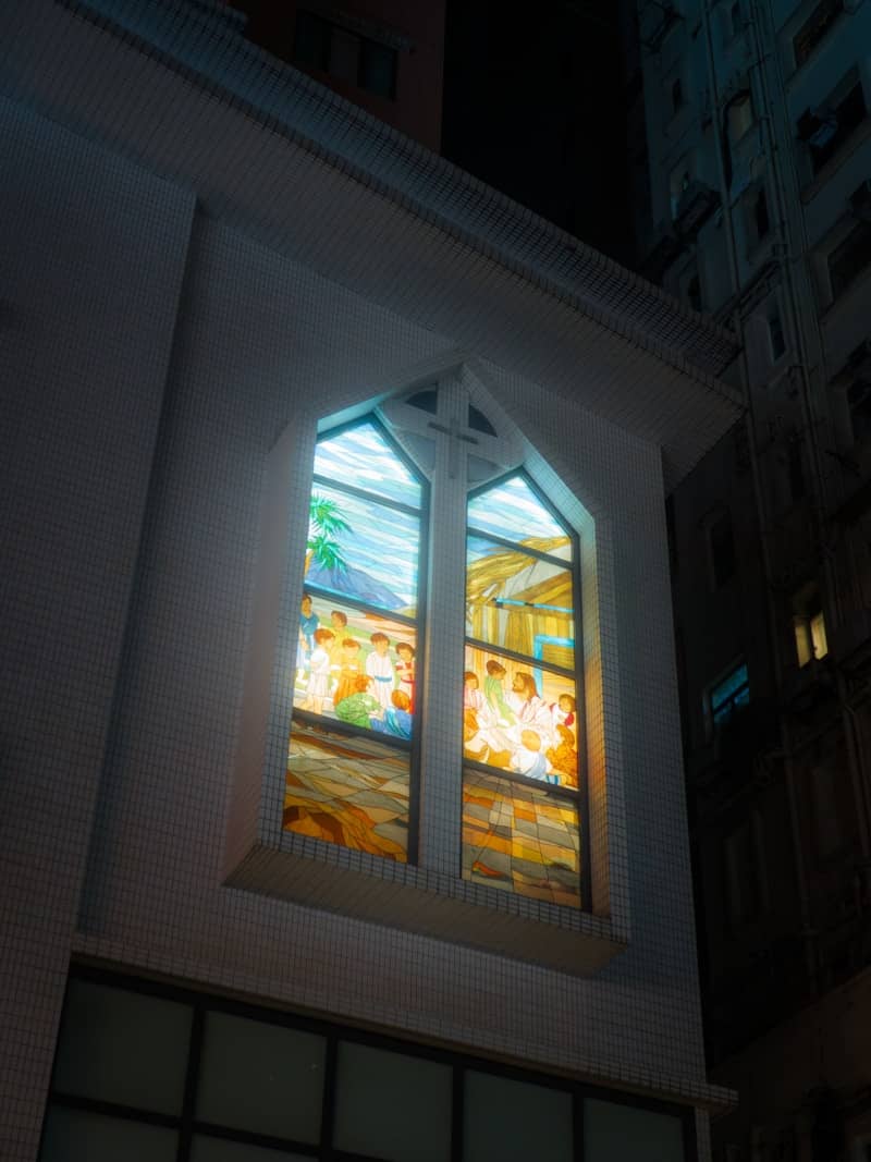 A church with a beautiful, stained glass window.