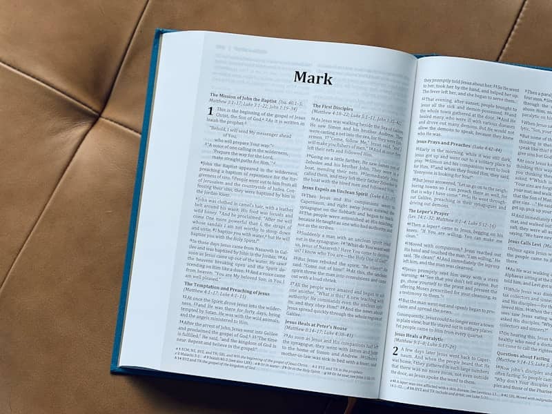Open bible with the gospel of mark is visible.