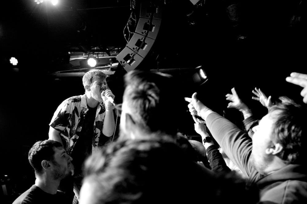 Christopher from Saves The Day sings to a crowd in Boston, MA