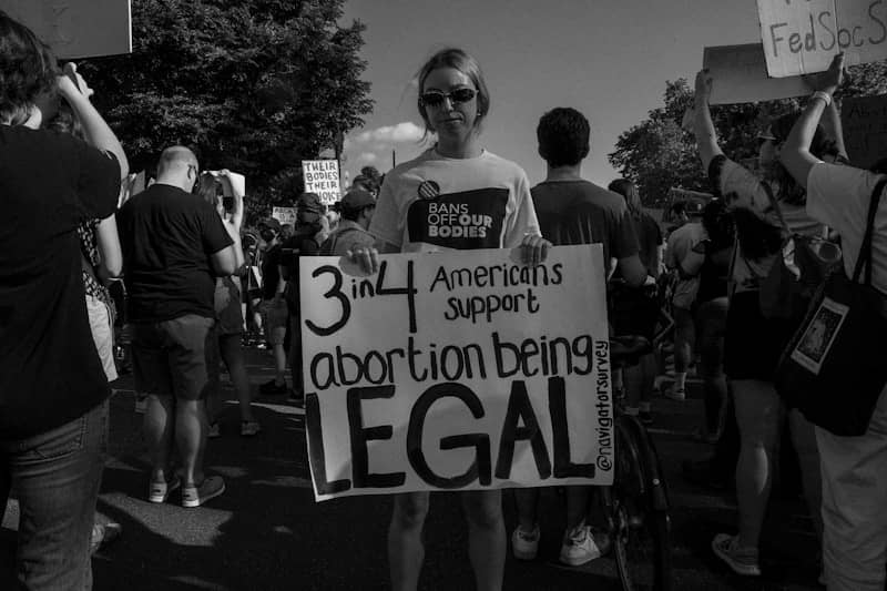 a person holding a sign