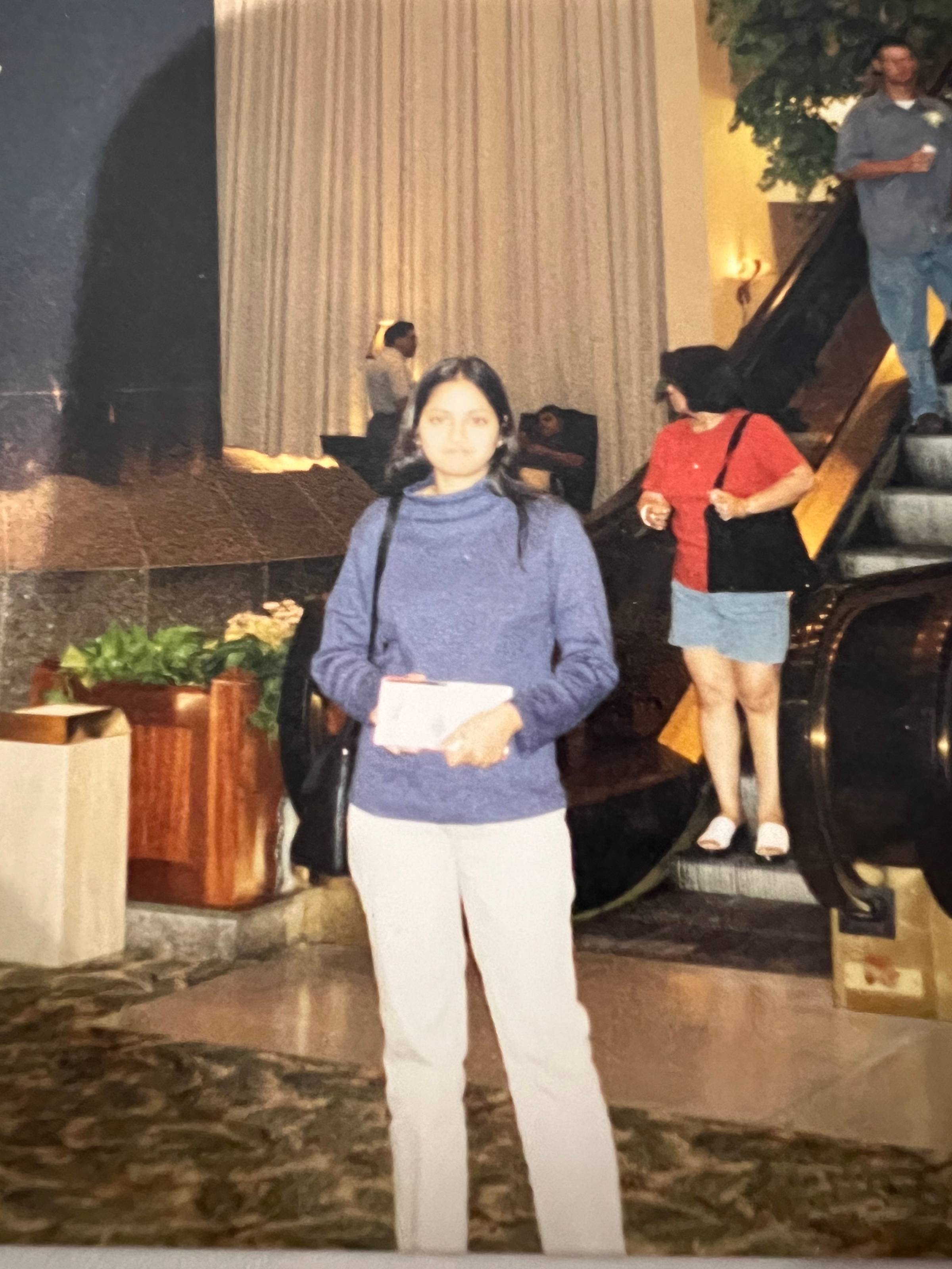 A girl standing in a lobby