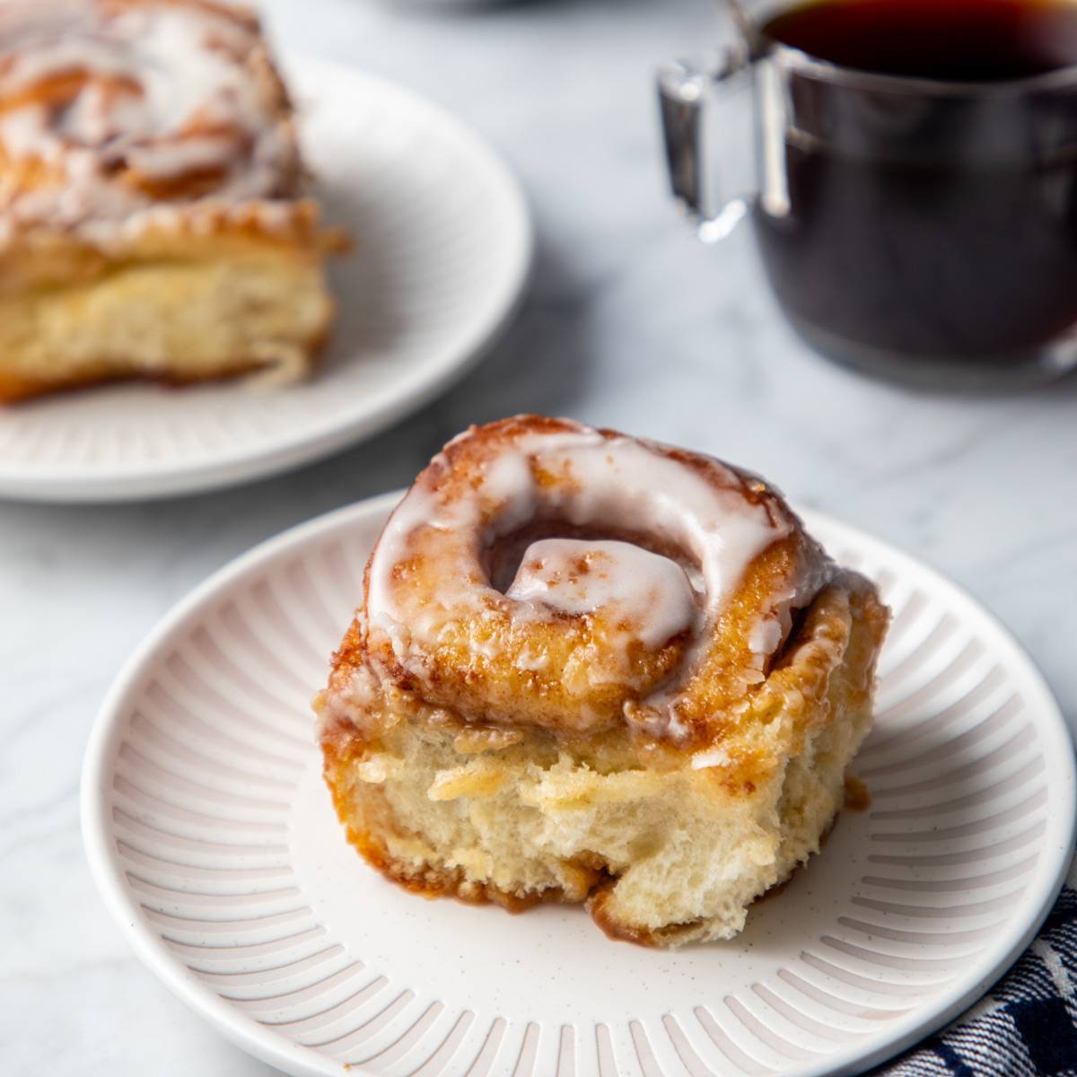 Tiktok cinnamon roll set on a white and cream plate.