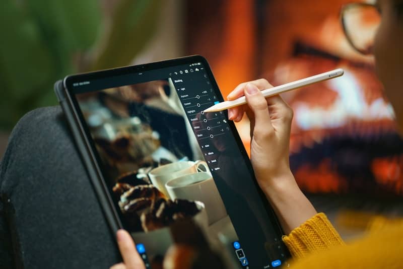 Someone is editing a photo with a digital pen.
