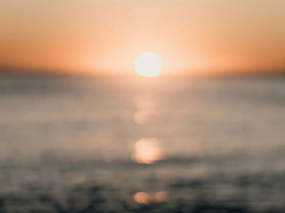 Blurred ocean sunrise photo symbolizing clarity