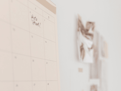 Close-up of a wall calendar and mood board, showing clear planning and focus instead of overstuffed content.