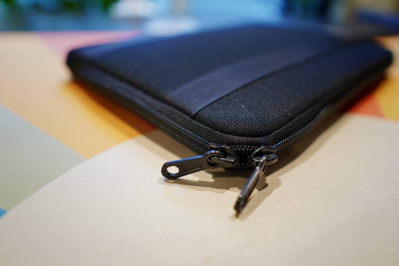 colored desk mat with a black zippered sleeve