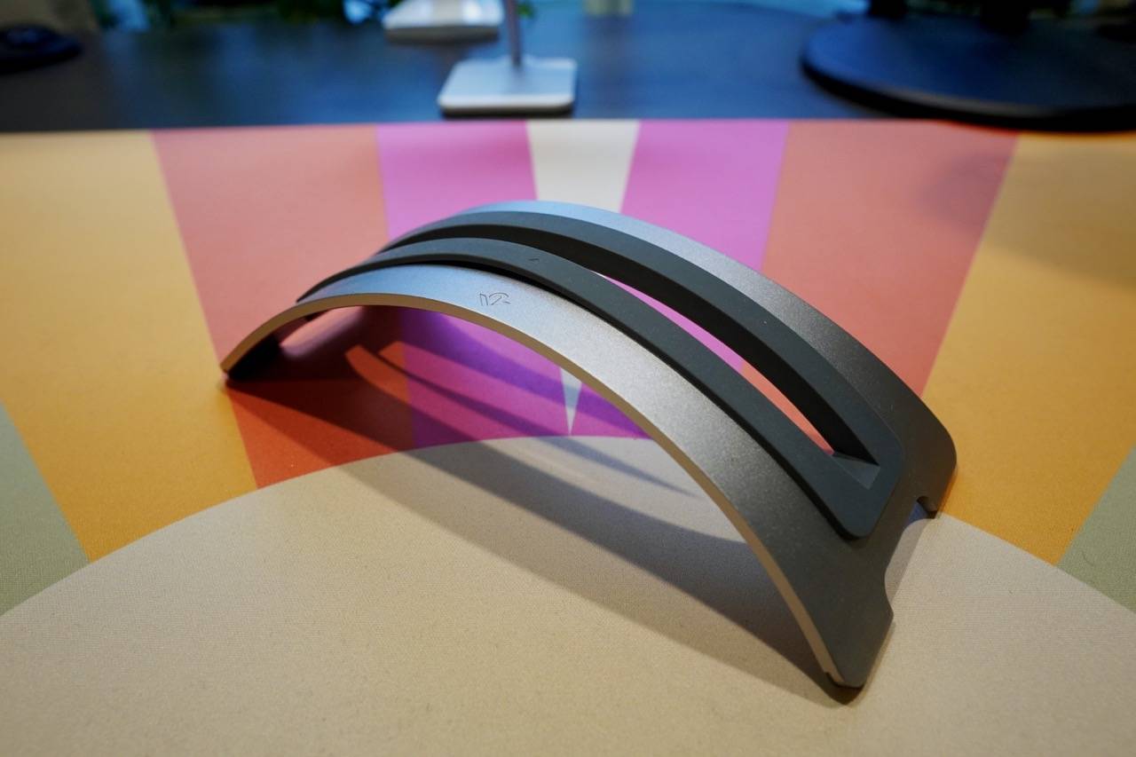 colored desk mat with a metal curvy laptop stand