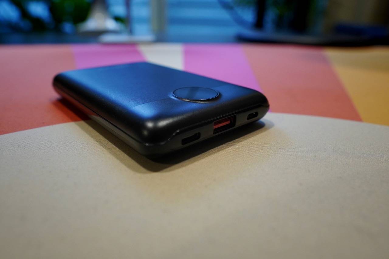 colored desk mat with a black battery pack