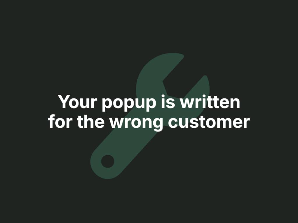 Dark charcoal graphic with a muted green wrench icon behind bold white text that reads "Your popup is written for the wrong customer."
