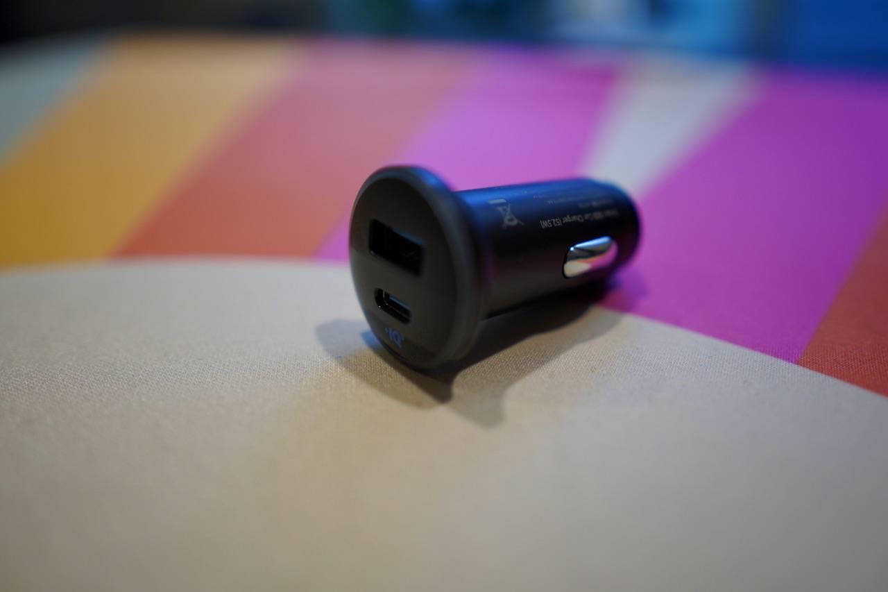 colored desk mat with a black car charger