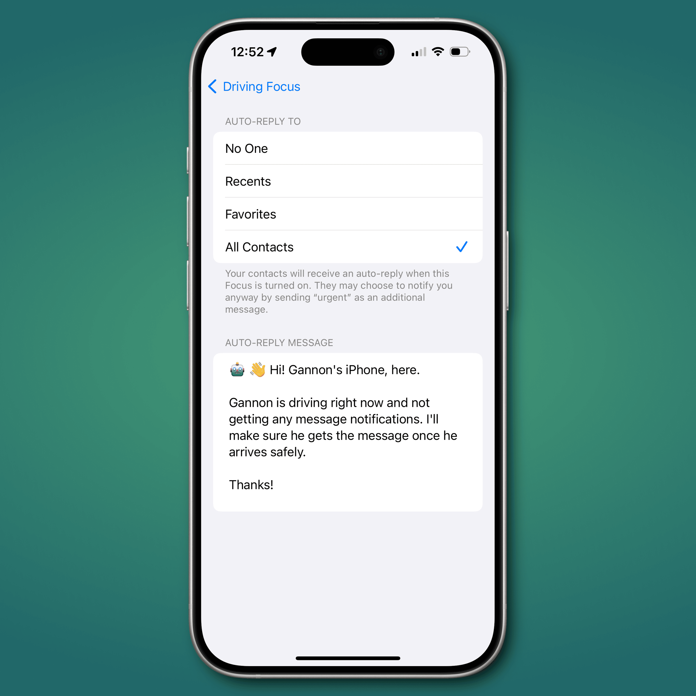 green gradient background with an iPhone frame in the center showing the Driving Focus auto-reply
