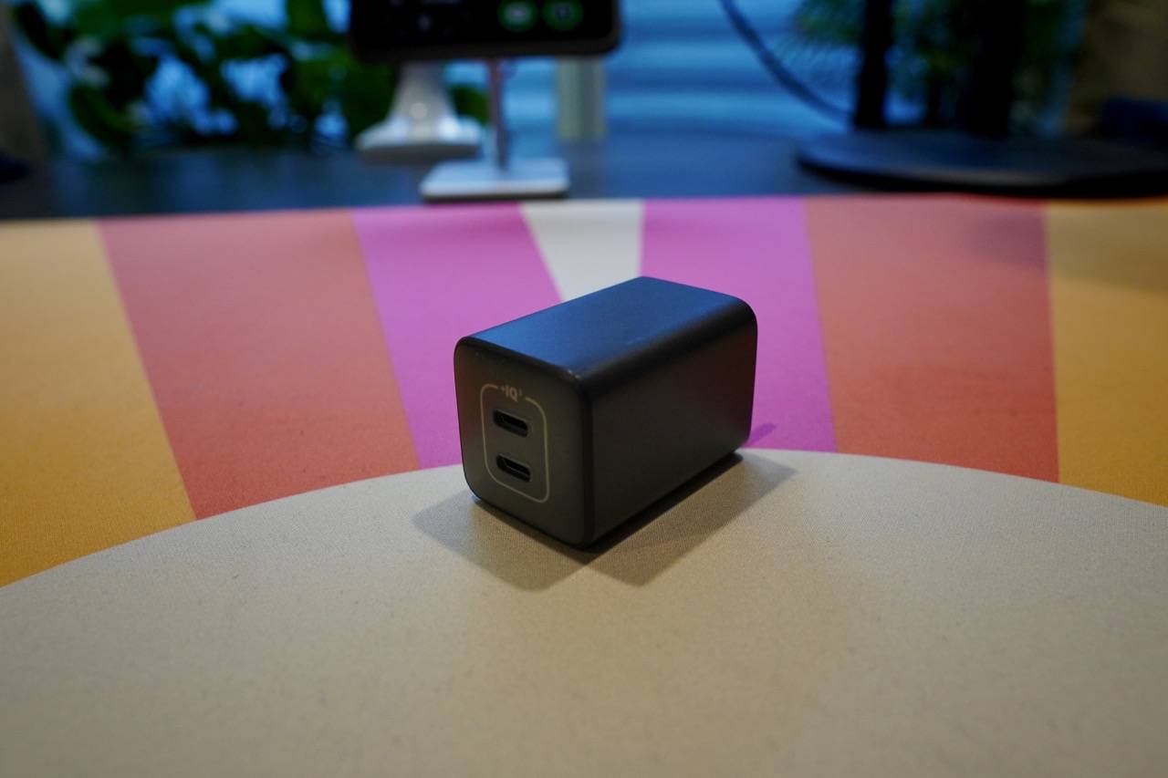 colored desk mat with a black 2-port charger