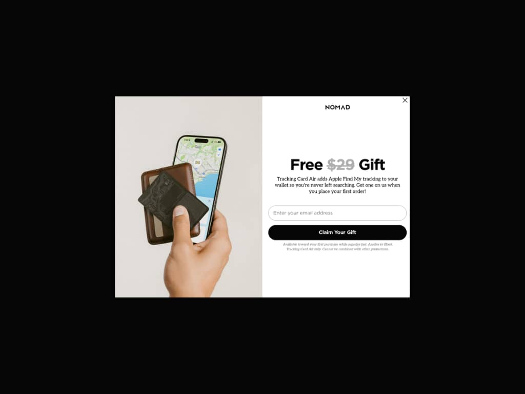 Nomad desktop popup: "Free $29 Gift" headline, lifestyle photo of wallet and iPhone with Find My map, "Claim Your Gift" button