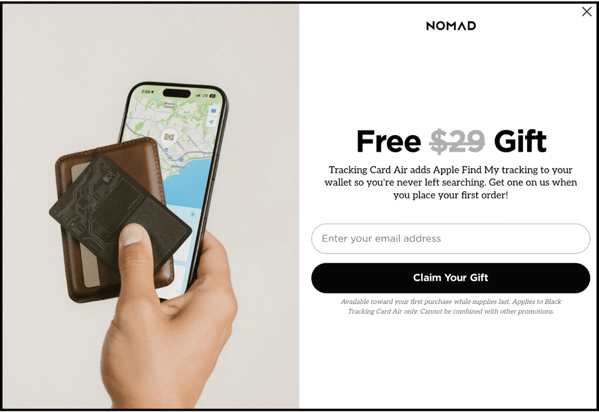 Nomad desktop popup: "Free $29 Gift" headline, "Claim Your Gift" button, wallet and iPhone with Find My map lifestyle photo, fine print