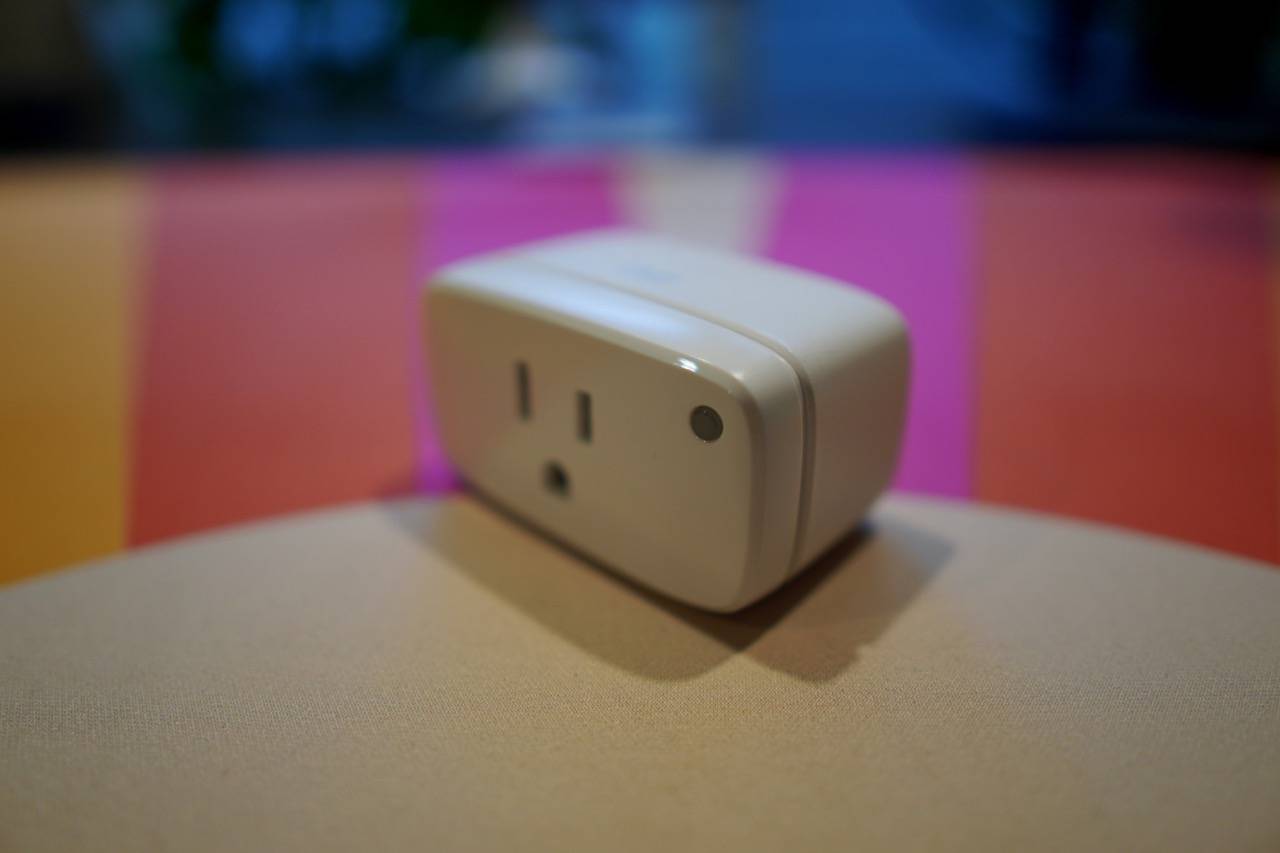 colored desk mat with a white smart plug