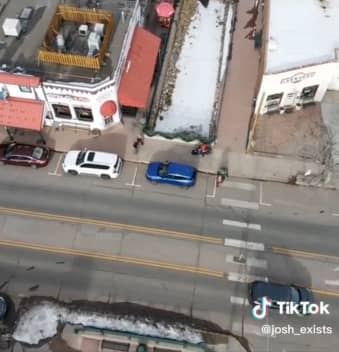 watch two people park their vehicles