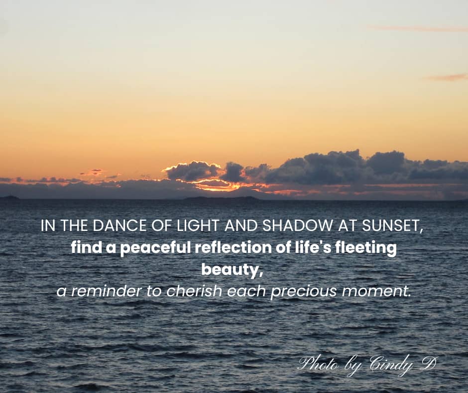 A glorious golden sunset behind azure clouds and ocean.