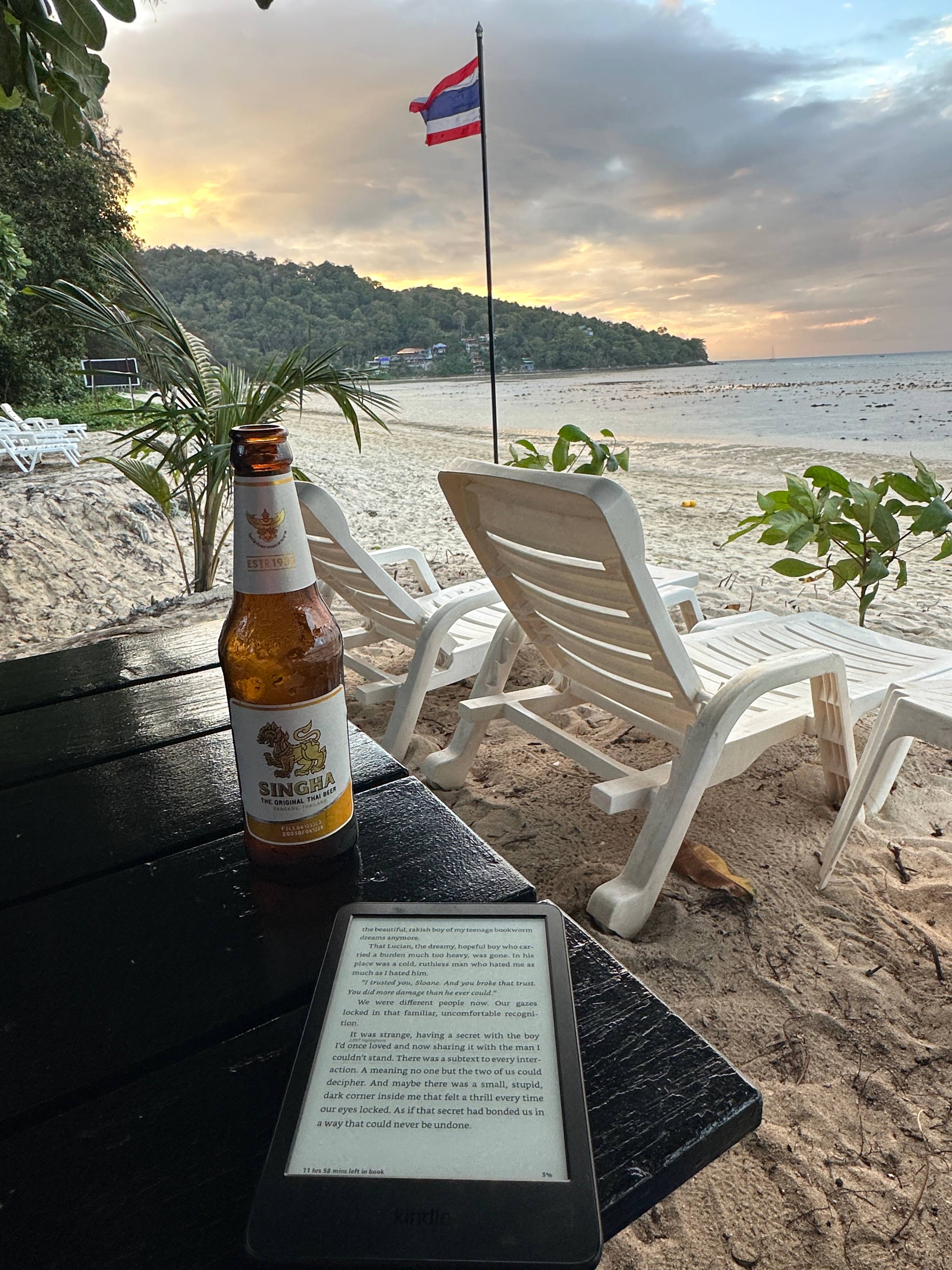 enjoying a beer with my kindle on a beach in Phuket Thailand