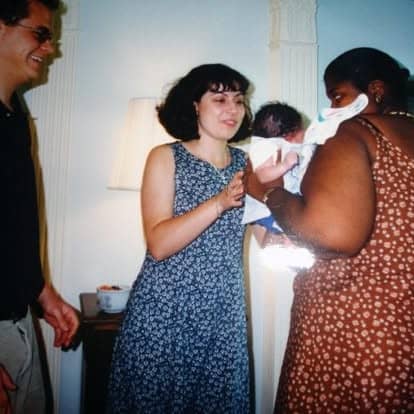 photo of Will's birth mom handing her baby to me at 8 days old