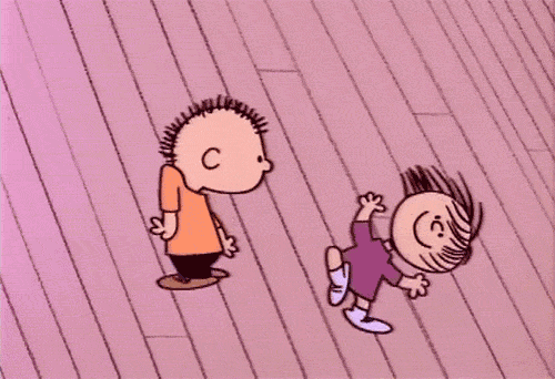 gif of two of the Peanuts gang doing a happy dance