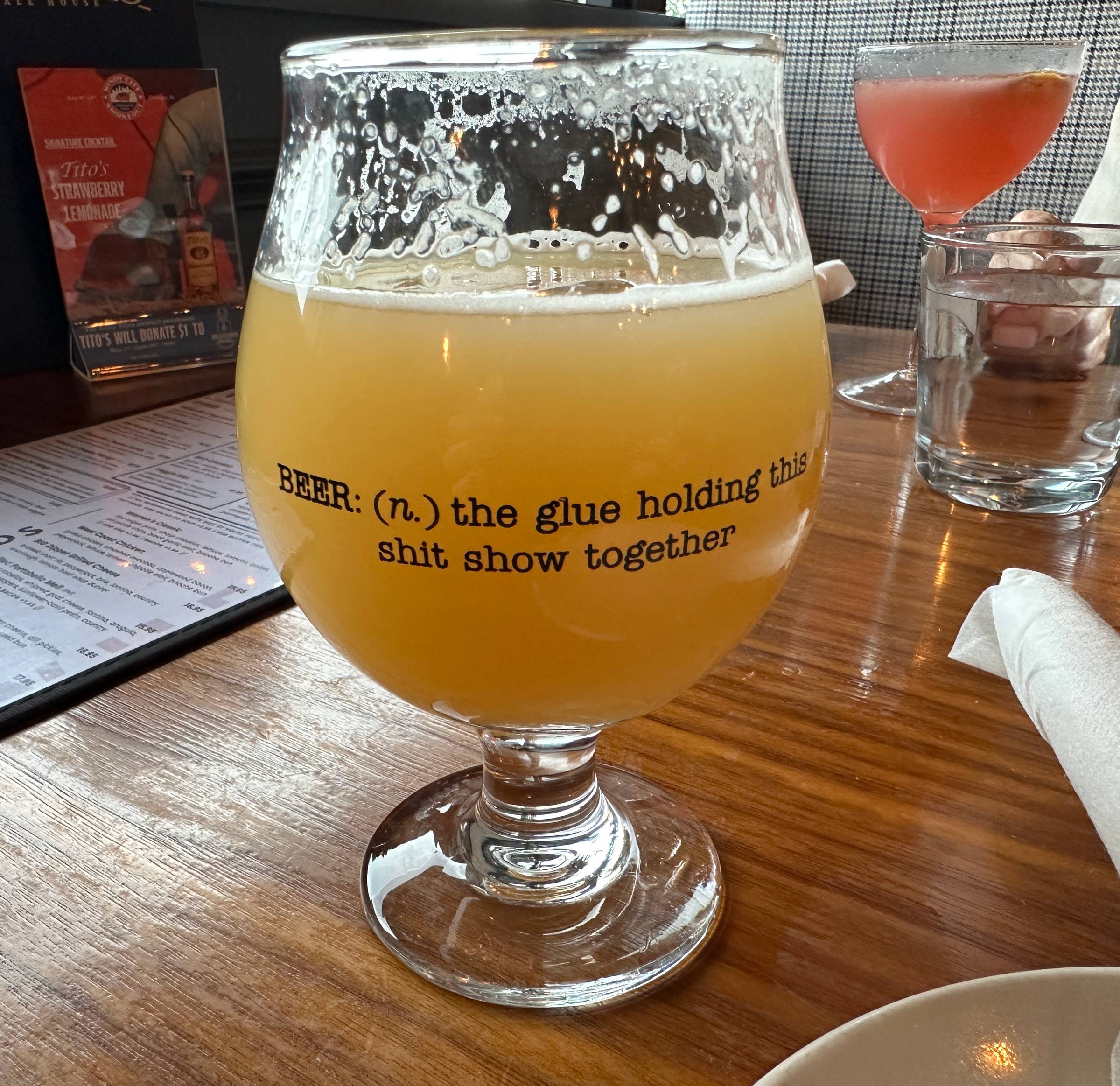 Beer glass with the words: BEER (n.) the glue holding this shit show together