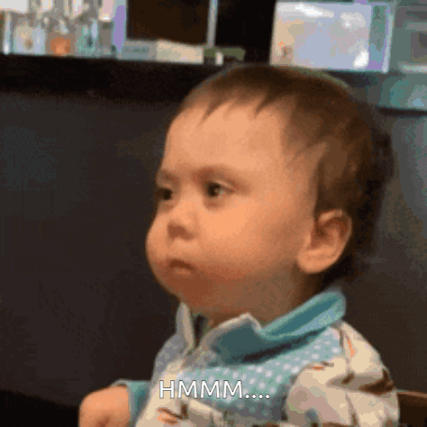 gif of a baby with suspicious eyes and the caption: HMMM...
