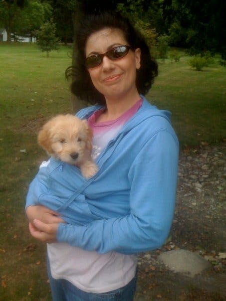 Julie holding Daisy as a puppy in 2009.