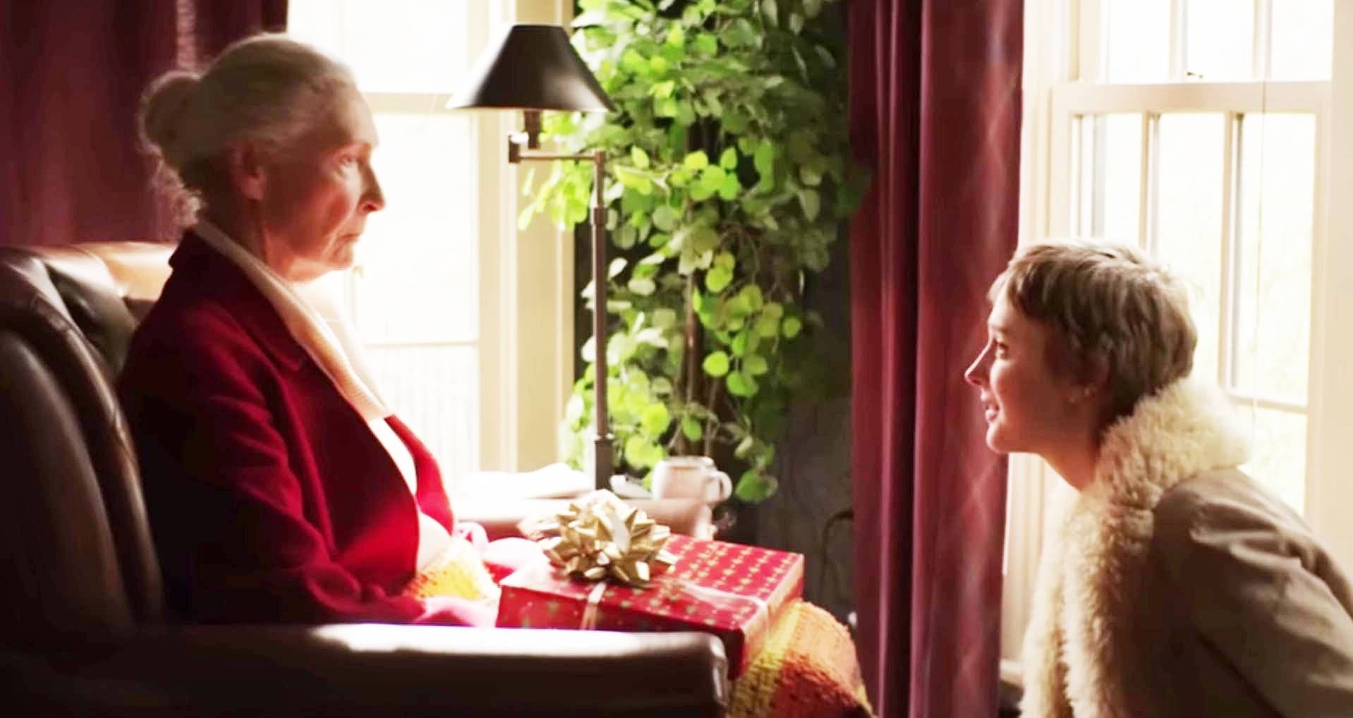 photo of a young woman talking to an elder woman