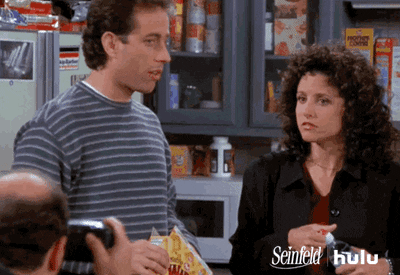 a gif of Jerry and Elaine from the TV show Seinfeld saying "cheese" for the camera