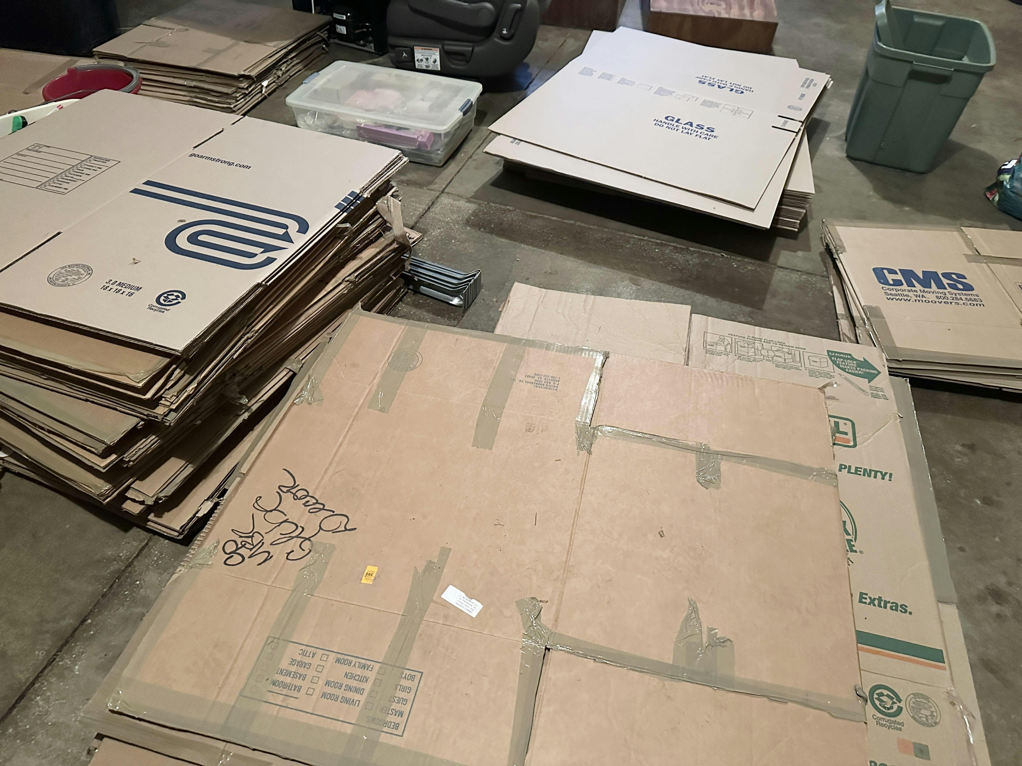 a stack of flat boxes waiting to be packed